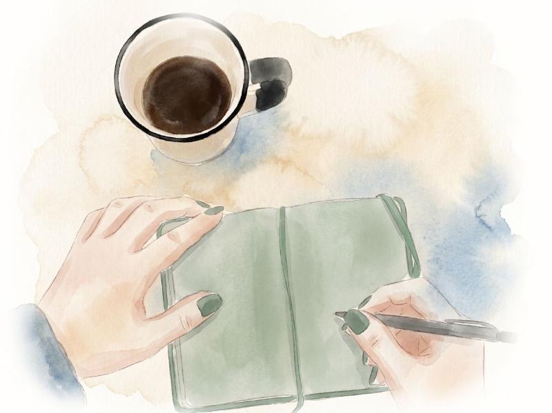 Woman writing with a pen into a book