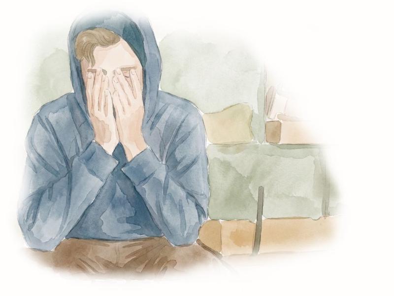 Tired man sitting on a couch
